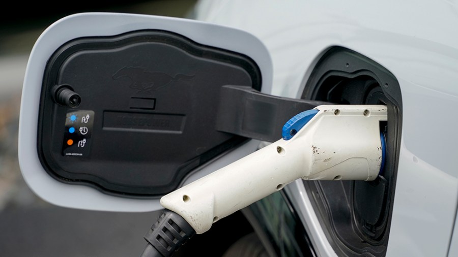 An electric vehicle charges