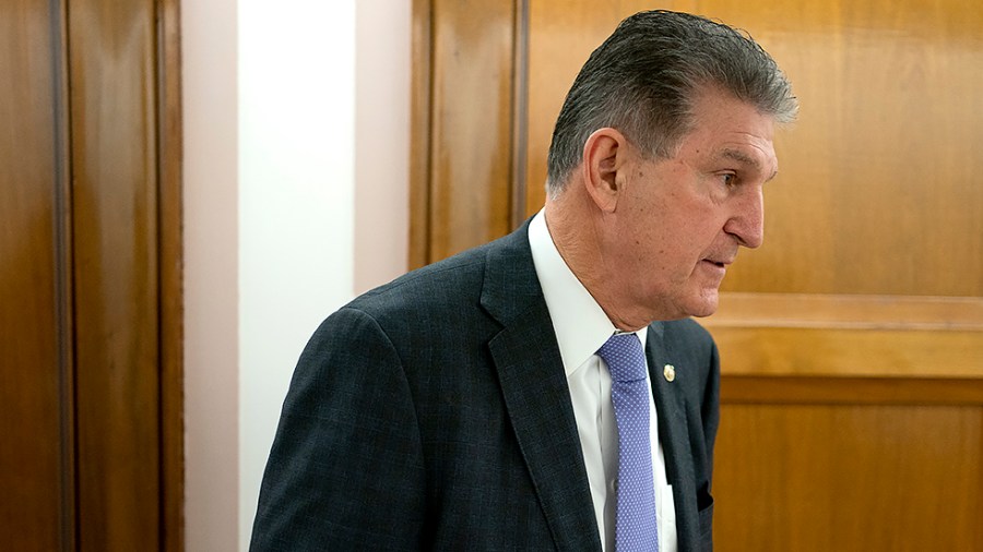 Sen. Joe Manchin (D-W.Va.) arrives for a Senate Energy and Natural Resources Committee nomination hearing on Tuesday, February 8, 2022 including nominee Laura Daniel-Davis to be an Assistant Secretary of the Interior.