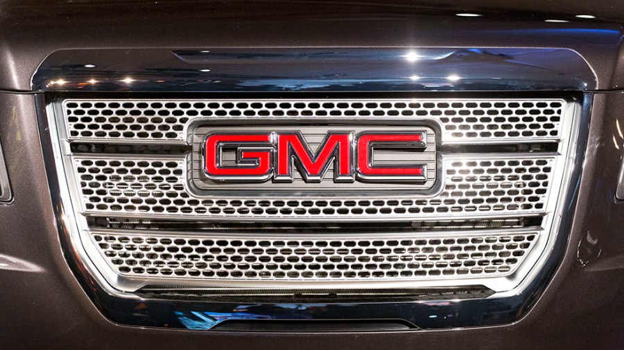 A GMC logo is displayed on the front grille of a vehicle