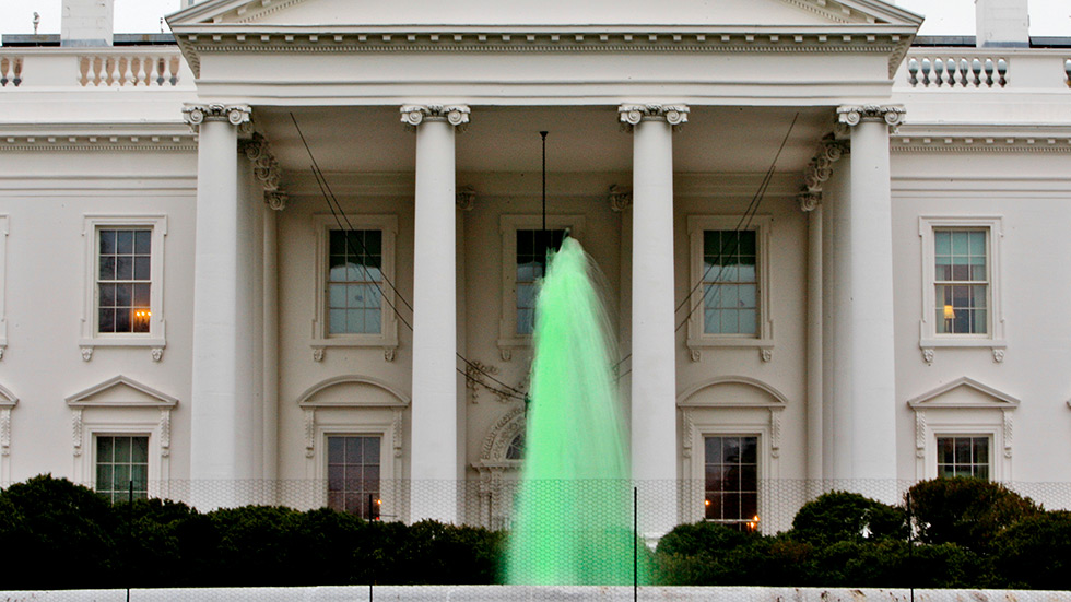 The fountain in front of the White House flows with green water