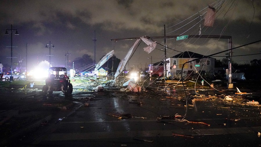 A debris lined street after a tornado.