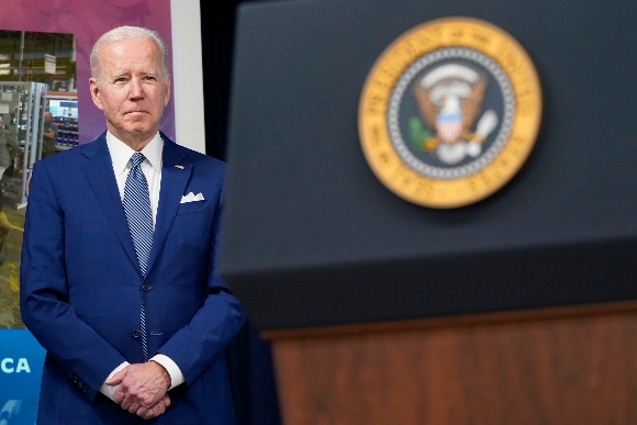 President Joe Biden listens as he attends an event