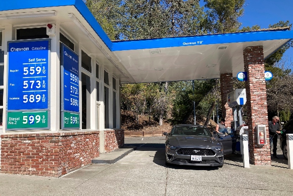 A motorist pumps gasoline at a gas station in Lafayette, Calif.