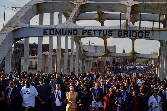 Vice President Kamala Harris marches on the Edmund Pettus Bridge after speaking in Selma, Ala.