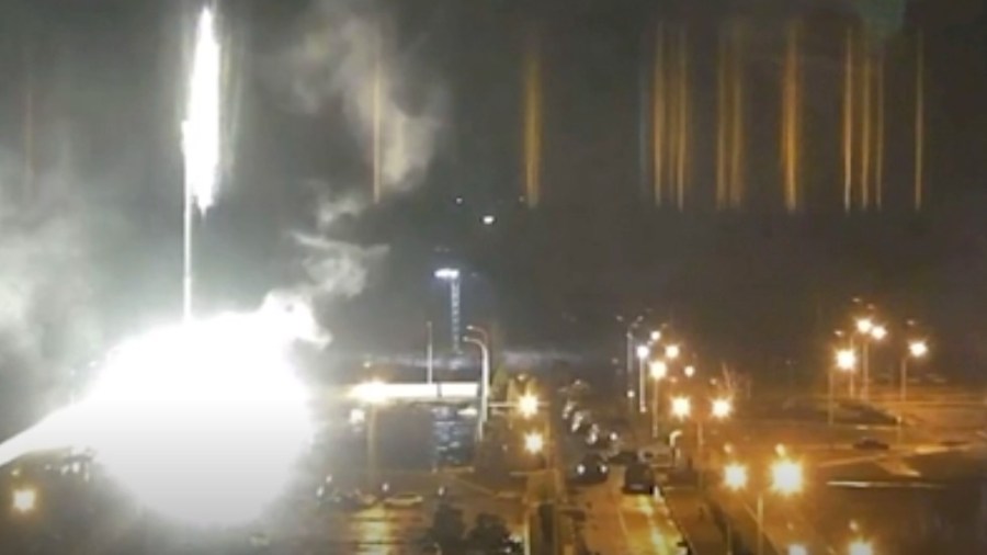 This image made from a video released by Zaporizhzhia nuclear power plant shows bright flaring object landing in grounds of the nuclear plant in Enerhodar, Ukraine