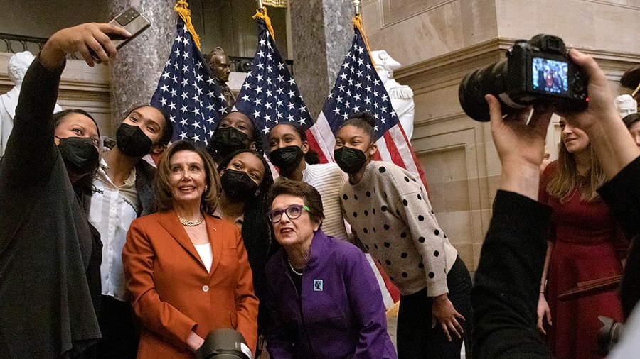 Speaker Nancy Pelosi (D-Calif.) and Billie Jean King pose for a selfie following the annual Women’s History Month Event in Statuary Hall on Capitol Hill, celebrating the 50th Anniversary of Title IX on Wednesday, March 9, 2022.