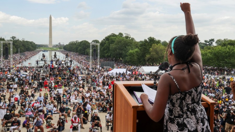 Yolanda Renee King, granddaughter of The Rev. Martin Luther King Jr., raises her fist as she speaks during the March on Washington, on the 57th anniversary of the Rev. Martin Luther King Jr.'s "I Have a Dream" speech