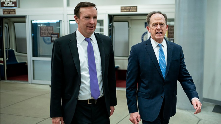 Sens. Chris Murphy (D-Conn.)and Pat Toomey arrive to the Capitol for votes regarding nominations on Thursday, March 10, 2022.