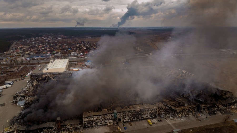 A factory and a store are burning after been bombarded in Irpin, in the outskirts of Kyiv