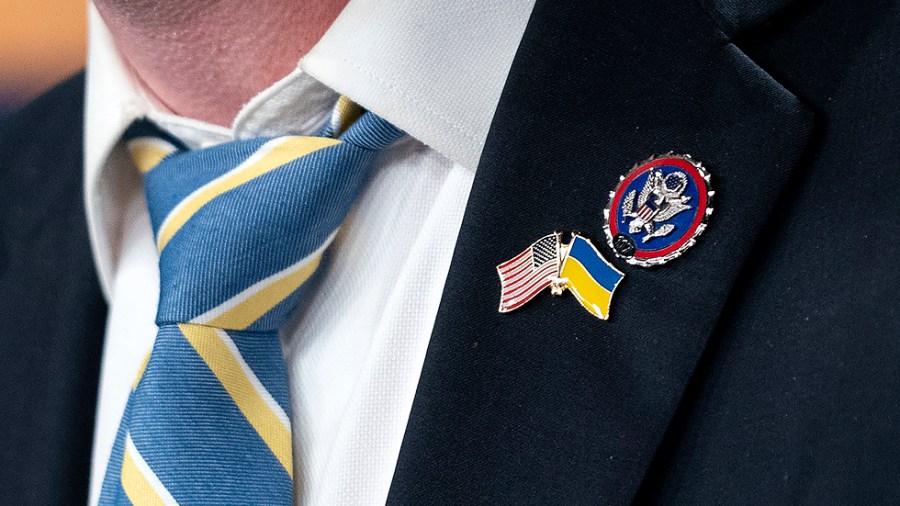 Rep. Brian Fitzpatrick (R-Pa.) wears a Ukrainian and American flag pin during a press conference on Thursday, March 3, 2022 to introduce the Banning Russian Energy Imports Act.