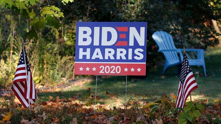 A campaign yard sign shows support for Biden and Harris