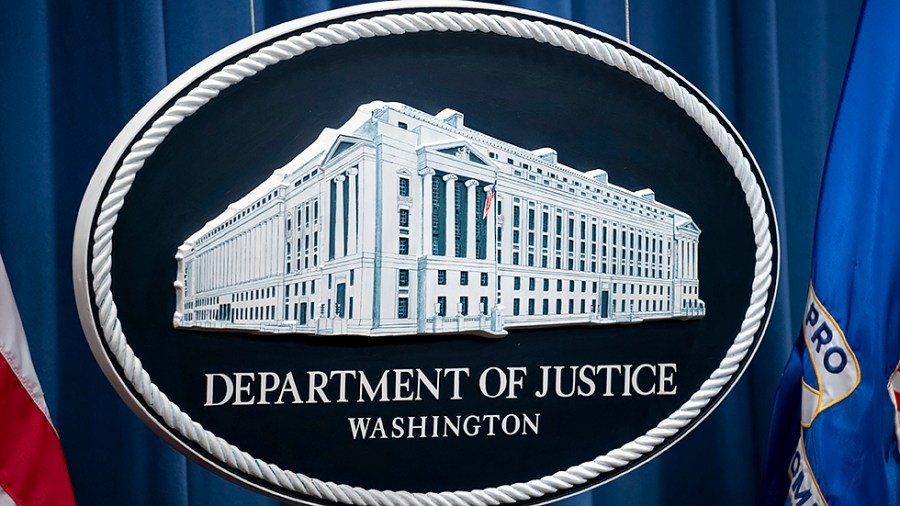 A logo of the Department of Justice is seen at their headquarters in Washington, D.C., on Friday, April 1, 2022.