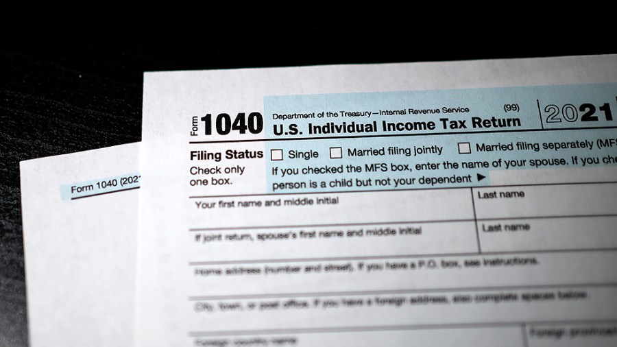 An IRS Form 1040 for 2021 is arranged for a photo illustration on Friday, April 15, 2022.