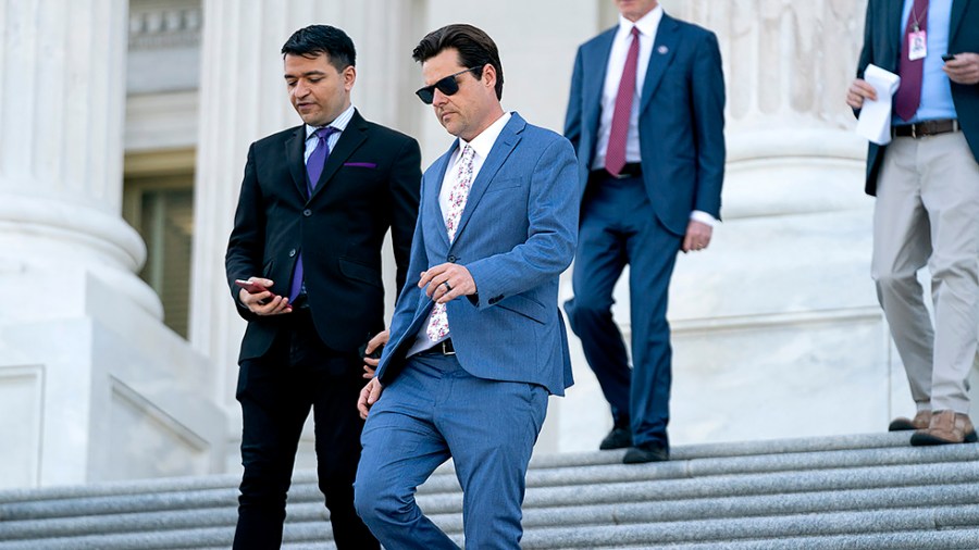 Rep. Matt Gaetz (R-Fla.) speaks to a reporter as he leaves the House Chamber following the last votes of the week on Thursday, April 28, 2022.