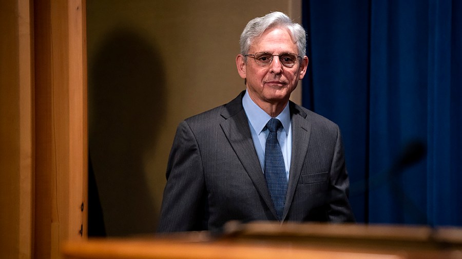 Attorney General Merrick Garland arrives for a press conference to discuss firearm trafficking enforcement in Tennessee and Chicago at the Department of Justice on Friday, April 1, 2022.