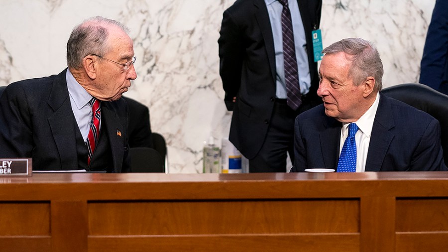 Sen. Chuck Grassley (R-Iowa) speaks to Senate Minority Whip Richard Durbin (D-Ill.) before a business meeting to move the nomination of Supreme Court nominee Ketanji Brown Jackson out of committee on Monday, April 4, 2022.