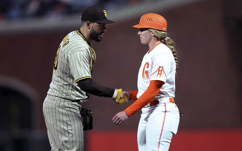 Eric Hosmer shakes hands with Alyssa Nakken