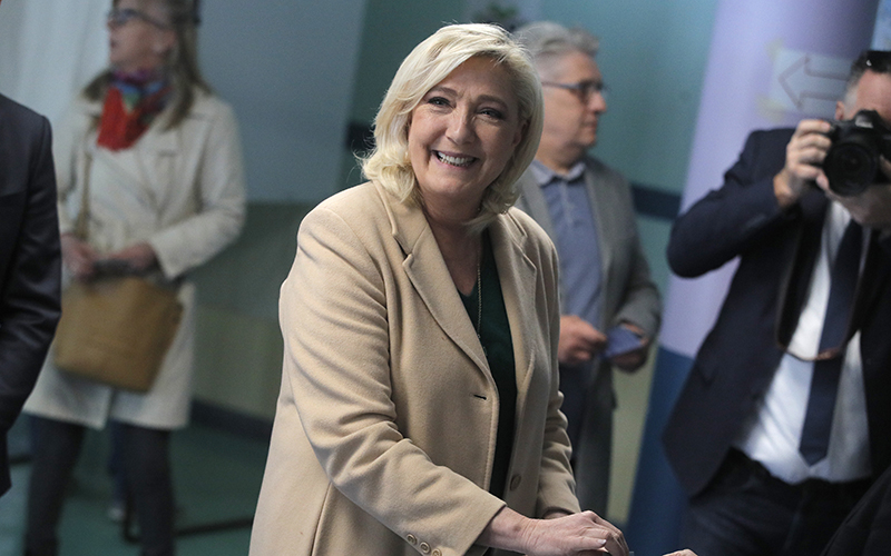 French far-right leader Marine Le Pen smiles at the camera