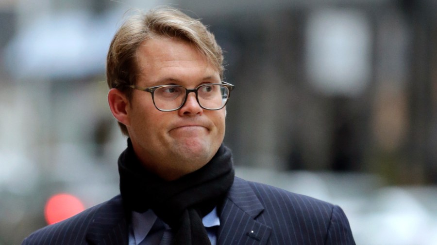 Mark Riddell arrives at federal court in Boston