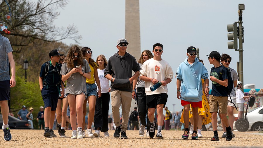 Tourists are seen on the National Mall in Washington, D.C., as COVID-19 restrictions have eased nationwide on Wednesday, April 13, 2022.