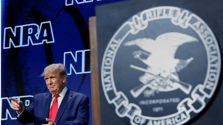 Former President Donald Trump stands on stage at the National Rifle Association's 2022 Annual Meetings and Exhibits.