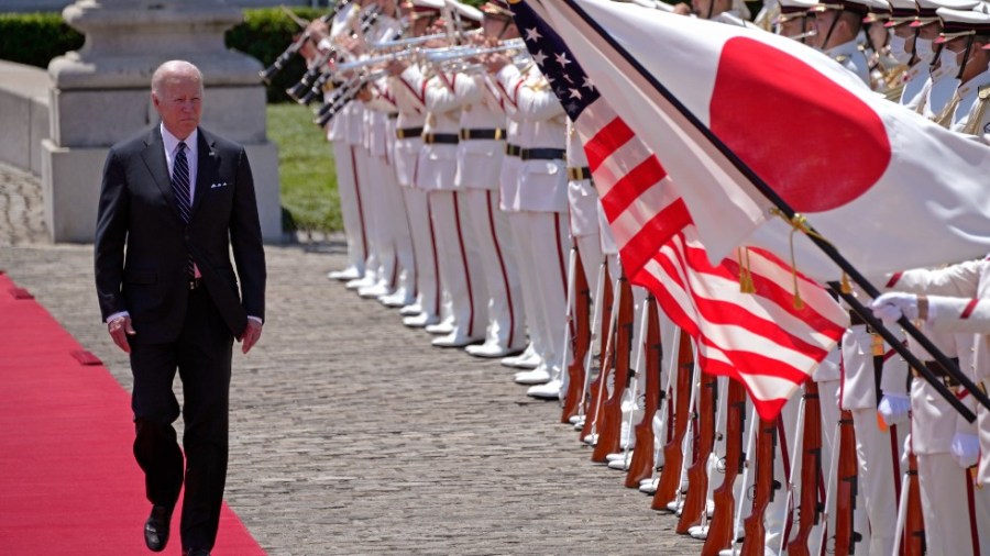 U.S. President Joe Biden, left, and with Japan's Prime Minister Fumio Kishida, reviews an honor guard during a welcome ceremony