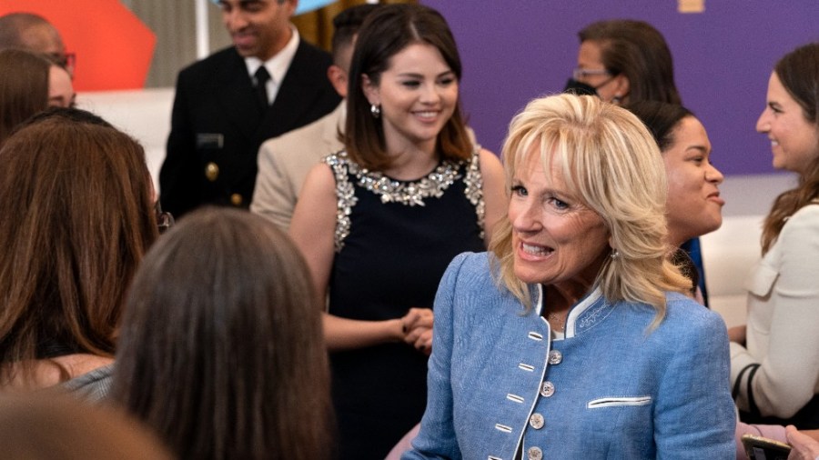 First lady Jill Biden, right, greets people followed by mental health advocate and actress Selena Gomez, after a White House Conversation on Youth Mental Health