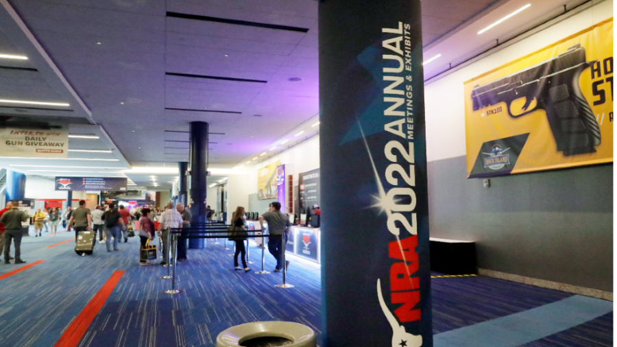 Attendees walk the halls of the National Rifle Association 2022 Annual Meetings & Exhibits.