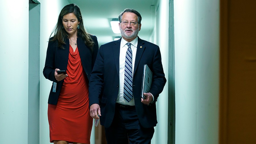 Sen. Gary Peters (D-Mich.) arrives for the weekly Senate Democratic policy luncheon on Tuesday, May 10, 2022.