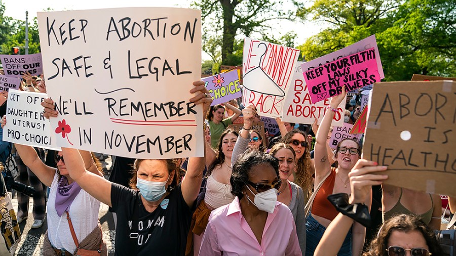 Protesters are seen outside the Supreme Court on Tuesday, May 3, 2022 after the leak of a draft majority opinion written by Justice Samuel Alito preparing for the court to overturn Roe v. Wade later this year.