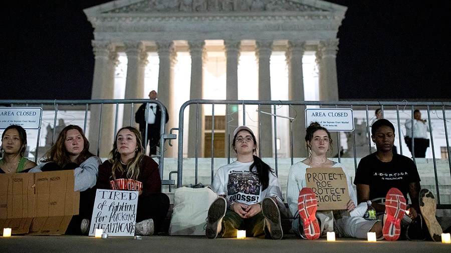 Following the leak of a Supreme Court draft that would overturn Roe v. Wade, protestors gather in the middle of the night in front of the Supreme Court in Washington, D.C., on Tuesday, May 3, 2022.