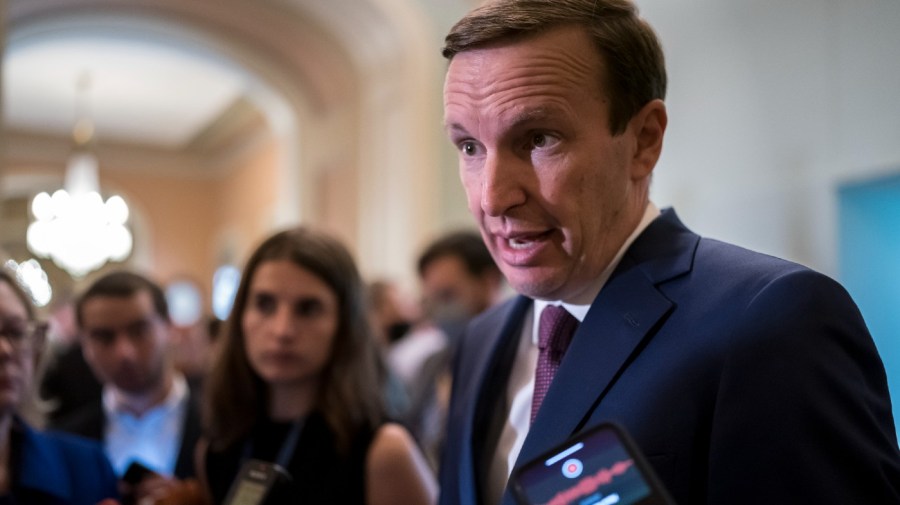 Sen. Chris Murphy, D-Conn., speaks to reporters outside the chamber to answer questions about his efforts to reach a bipartisan Senate agreement to rein in gun violence