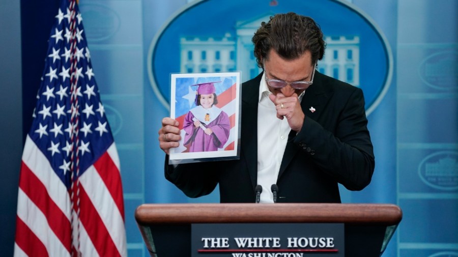 Actor Matthew McConaughey holds an image of Alithia Ramirez, 10, who was killed in the mass shooting at an elementary school in Uvalde, Texas, as he speaks during a press briefing at the White House.