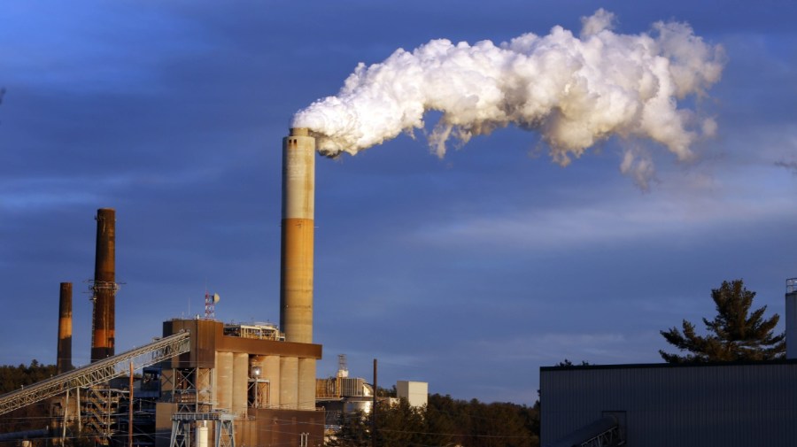 A plume of steam billows from a coal-fired power station.