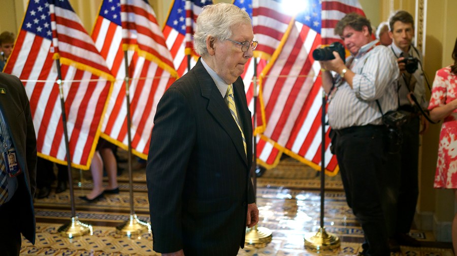 Minority Leader Mitch McConnell (R-Ky.) returns to his office following a procedural vote regarding a nomination on Wednesday, June 22, 2022.