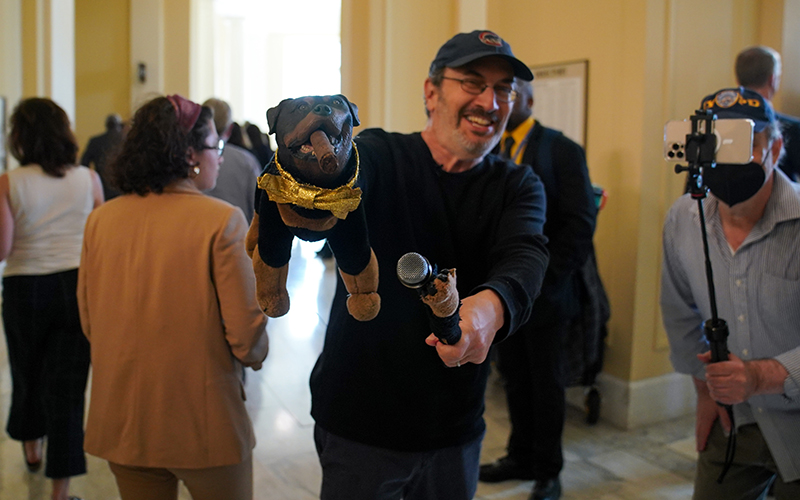 Triumph the Insult Comic Dog is seen with a microphone