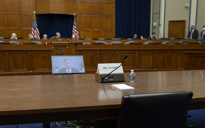 An empty chair reserved for Washington Commanders owner Dan Snyder