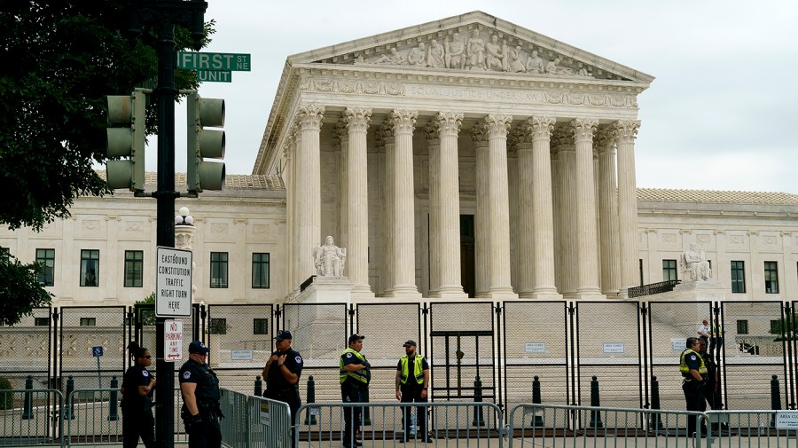 U.S. Capitol Police are seen outside the Supreme Court on Tuesday, June 21, 2022 as the court finishes up its term which includes an opinion that could strike Roe v. Wade.