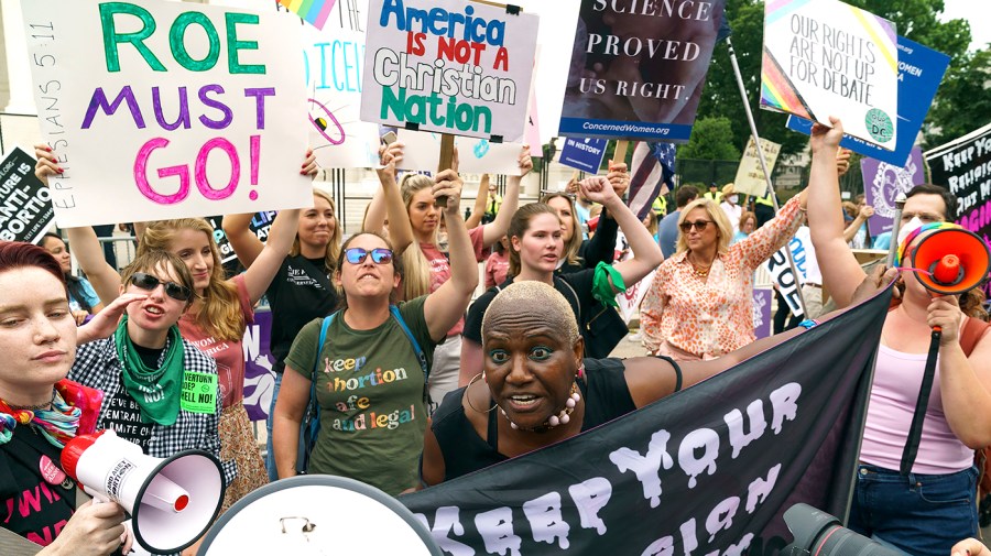 Protesters for and against abortion rights demonstrate outside the Supreme Court on Tuesday, June 21, 2022 as the court finishes up its term which includes an opinion that could strike Roe v. Wade.