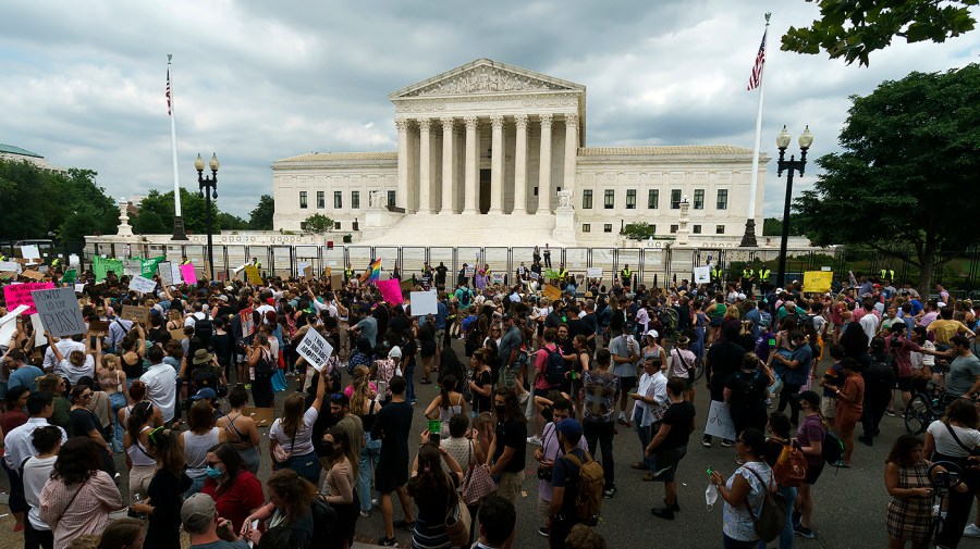 Protesters for abortion rights demonstrate outside the Supreme Court on Friday, June 24, 2022 after the court released a decision to strike Roe v. Wade.