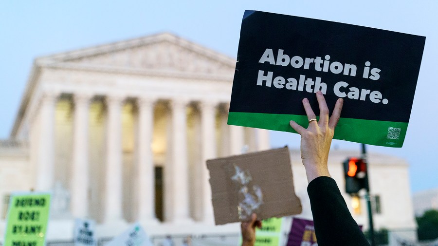 Protesters for abortion rights demonstrate outside the Supreme Court on Friday, June 24, 2022 after the court released a decision to strike Roe v. Wade.