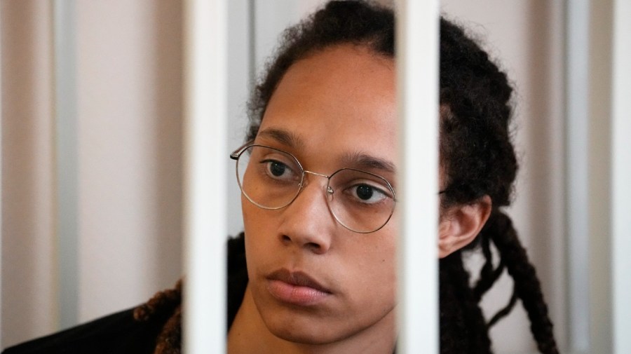 WNBA star and two-time Olympic gold medalist Brittney Griner sits in a cage at a court room prior to a hearing, in Khimki just outside Moscow, Russia, Wednesday, July 27, 2022.