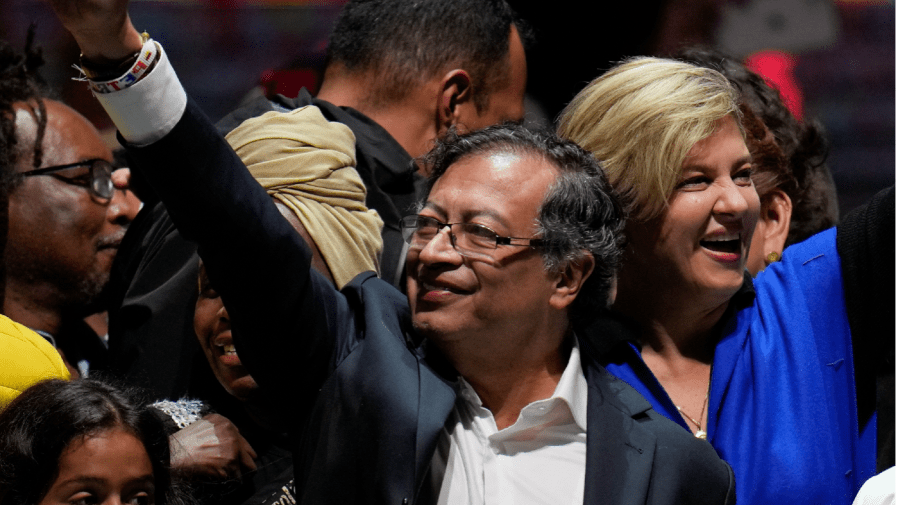 Former rebel Gustavo Petro and his wife Veronica Alcocer celebrate before supporters after winning a runoff presidential election in Bogota, Colombia, Sunday, June 19, 2022.