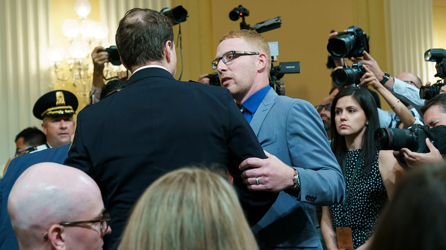 Jan. 6 rioter Stephen Ayres of Ohio speaks to D.C. Metropolitan Police Officer Daniel Hodges following a House Jan. 6 committee hearing on Tuesday, July 12, 2022 focusing on the ties between former President Trump and far-right extremist groups.