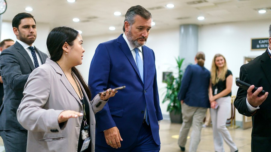 Sen. Ted Cruz (R-Texas) speaks to reporters as he arrives to the Capitol for procedural votes regarding the nomination of Federal Reserve Board Member nominee Michael Barr on Wednesday, July 13, 2022.