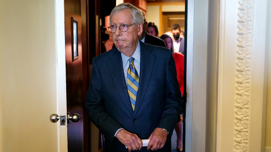 Senate Majority Leader Mitch McConnell (R-Ky.) returns to his office after the weekly policy luncheon on Tuesday, July 19, 2022.