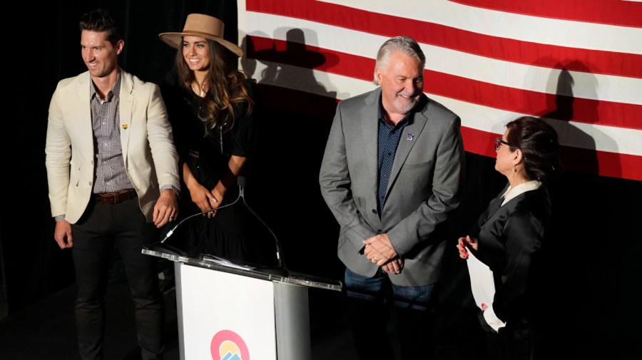 GOP Senate nominee Joe O'Dea (center) prepares to speak in Denver.