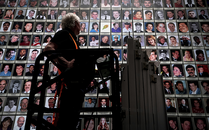 A person places a portrait of Antonio Dorsey Pratt in the 9/11 Memorial & Museum