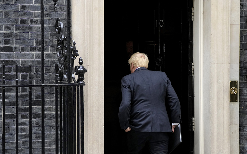 Prime Minister Boris Johnson returns inside his residence