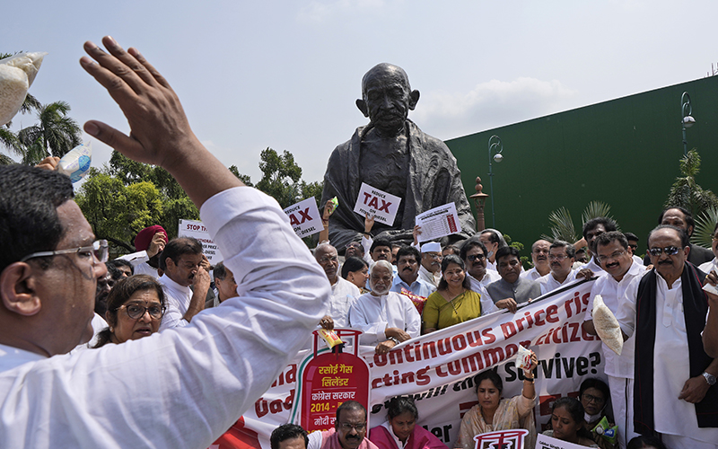 Various lawmakers in New Delhi shout slogans during a protest